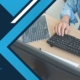 man types on keyboard next to blue and white background and FutureTranz logo