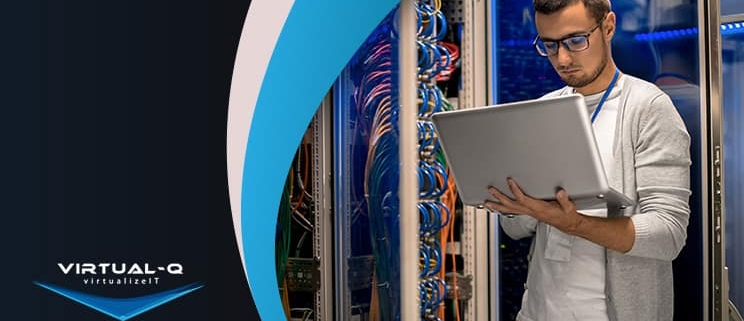 man holding laptop in data center next to multicolor background and FutureTranz logo