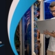 man holding laptop in data center next to multicolor background and FutureTranz logo