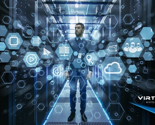 man in suit standing in data center behind hexagonal IT graphics