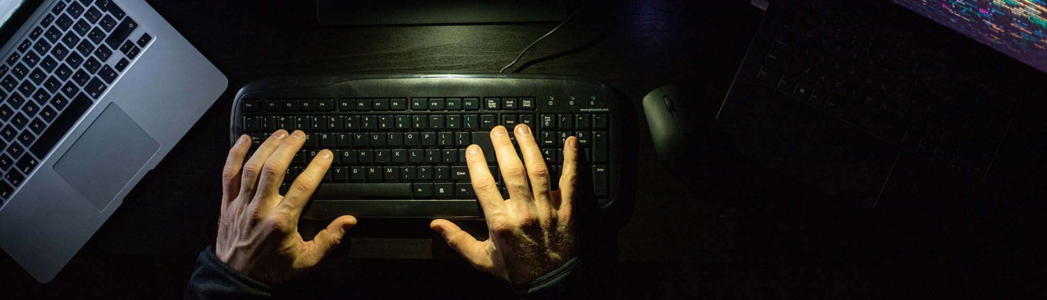 hacker coding at night cybersecurity concept